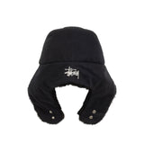 Black winter hat with fur trim and Stussy logo on a white background