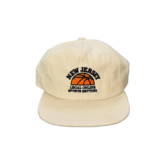 Natural cap with 'New Jersey Legal Online Sports Betting' text on a black background