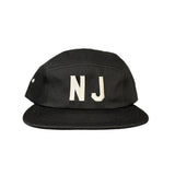 Black cap with 'NJ' 