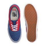 Blue and red Vans sneakers on a light gray background