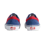 Blue and red sneakers with white soles on a light gray background