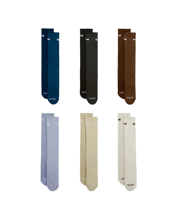 Set of six pairs of socks in different colors on a white background