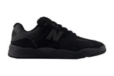 Black sneaker with New Balance logo on a light gray background